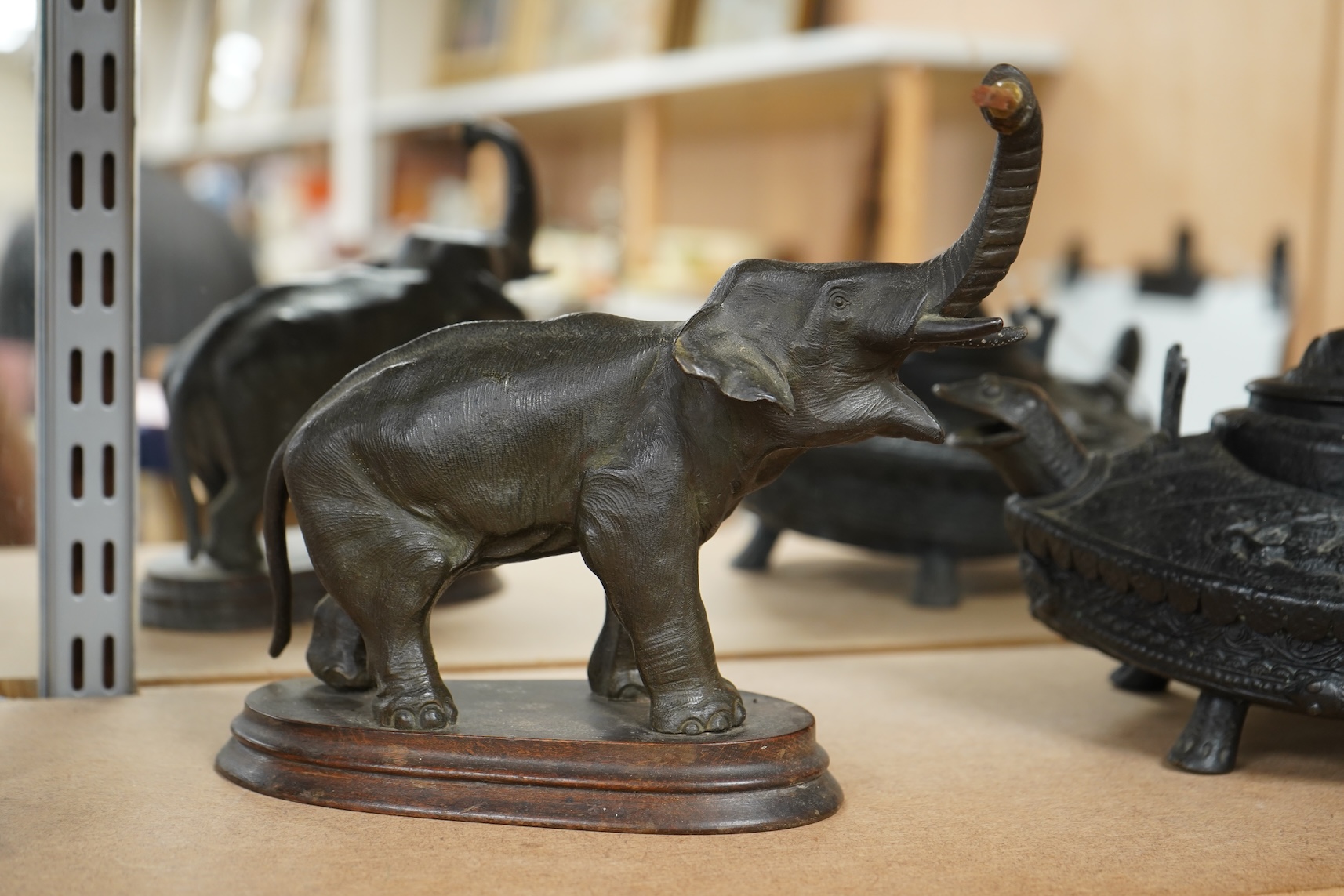 A bronzed metal model of an elephant and a bronze model of a greyhound, tallest 20cm